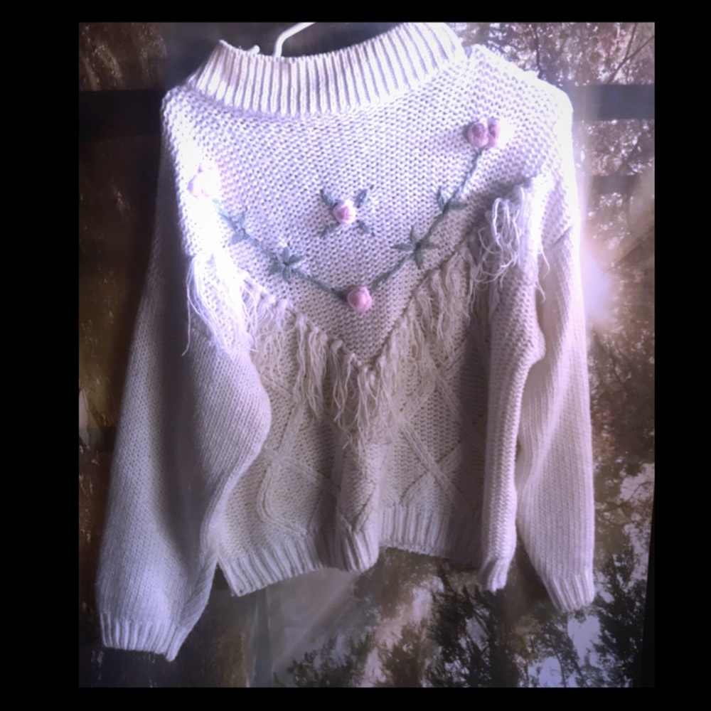 Hand knitted sweater.
